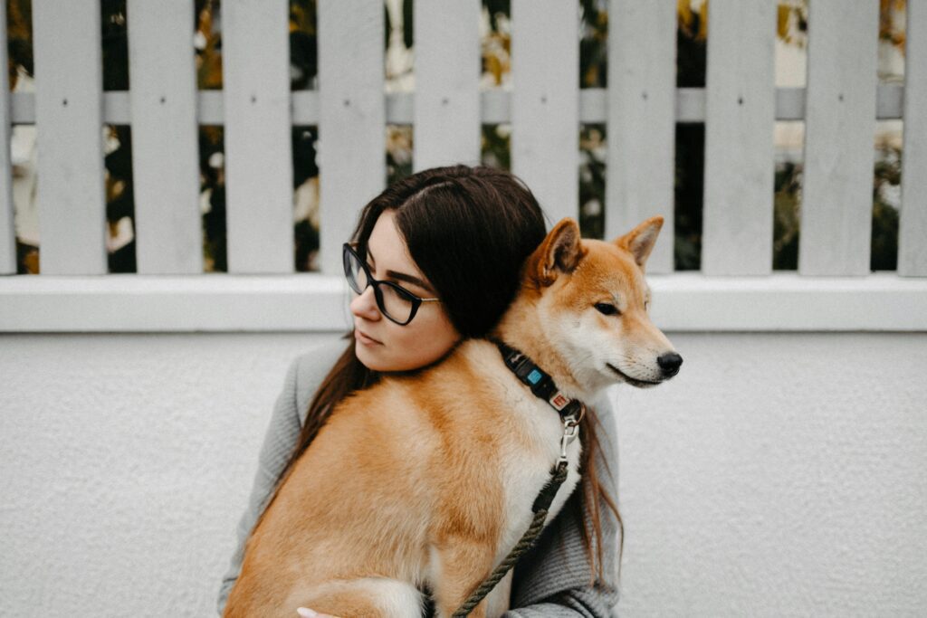 Woman With Her Dog, representing pet sitting services.